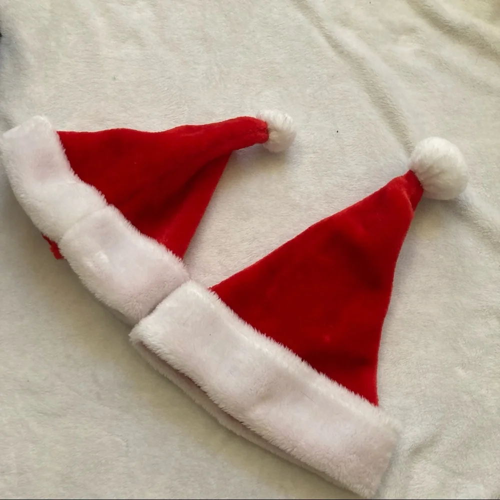 Set of two Santa hats with white pompoms